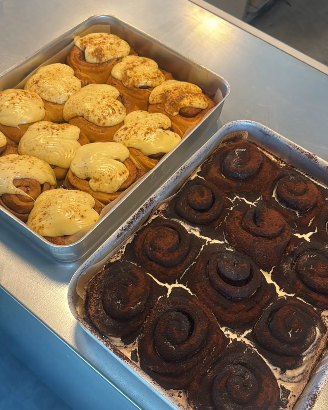 Trays of cinnamon buns and pastries fresh from the oven